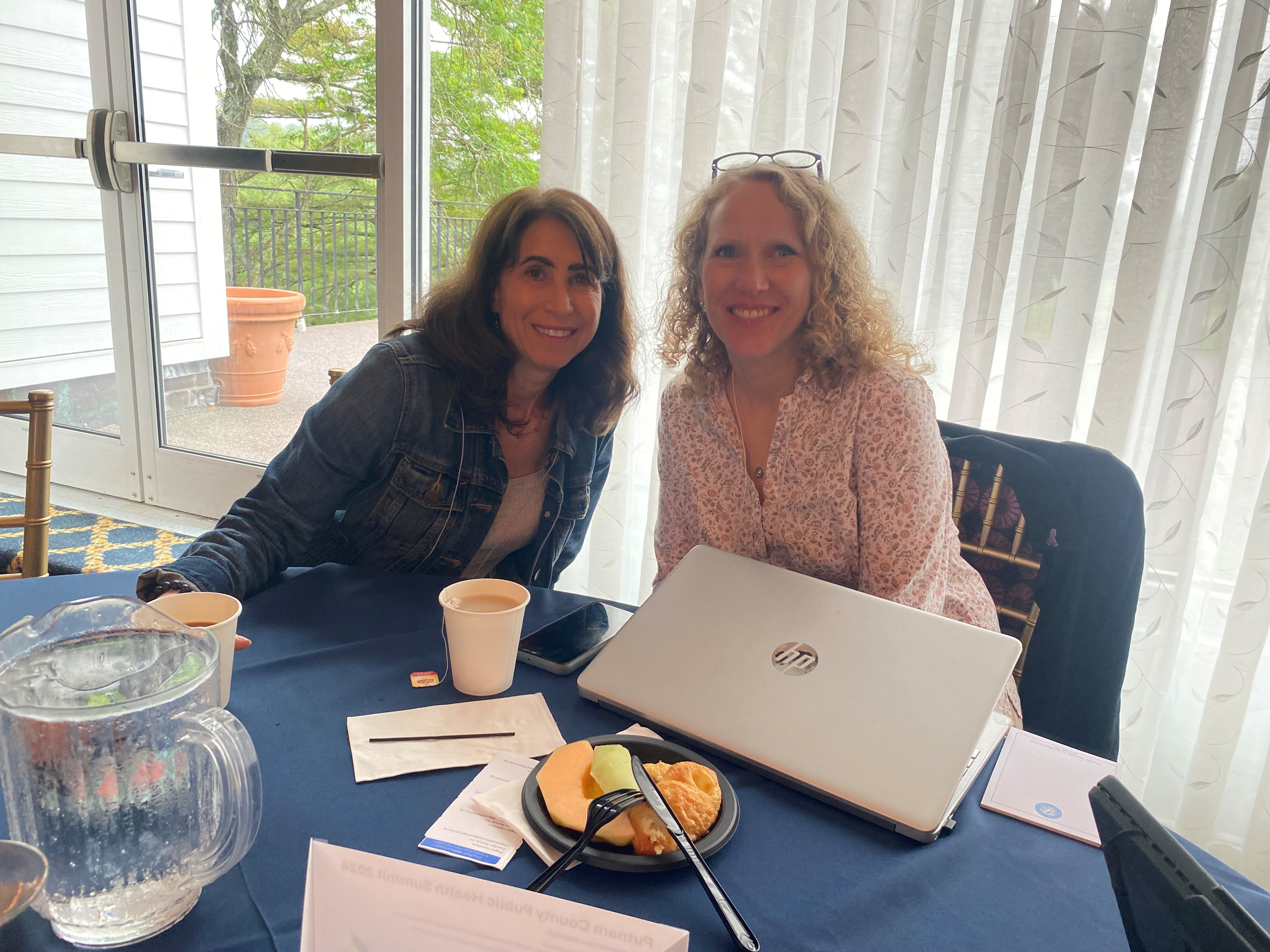 Longtime colleagues Marla Behler, LMSW, director of the Child Advocacy Center of Putnam County, shares a moment with Megan Castellano, MPA, program executive director, Guardian Homefront at Guardian Revival, and formerly executive director of the Mental Health Association of Putnam.